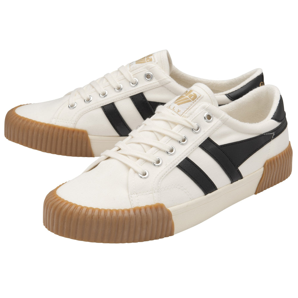 A pair of white and black Gola low-top sneakers with brown soles.