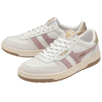 A pair of white trainers with pink stripes and gold heel tabs are presented from an angle.
