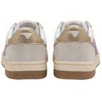 The rear view of two white trainers with gold heel tabs and light grey suede accents.