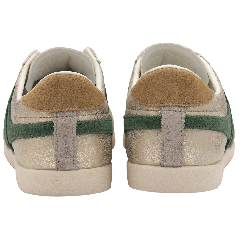 A rear view of a pair of Gola Orchid Platform gold and green sneakers.