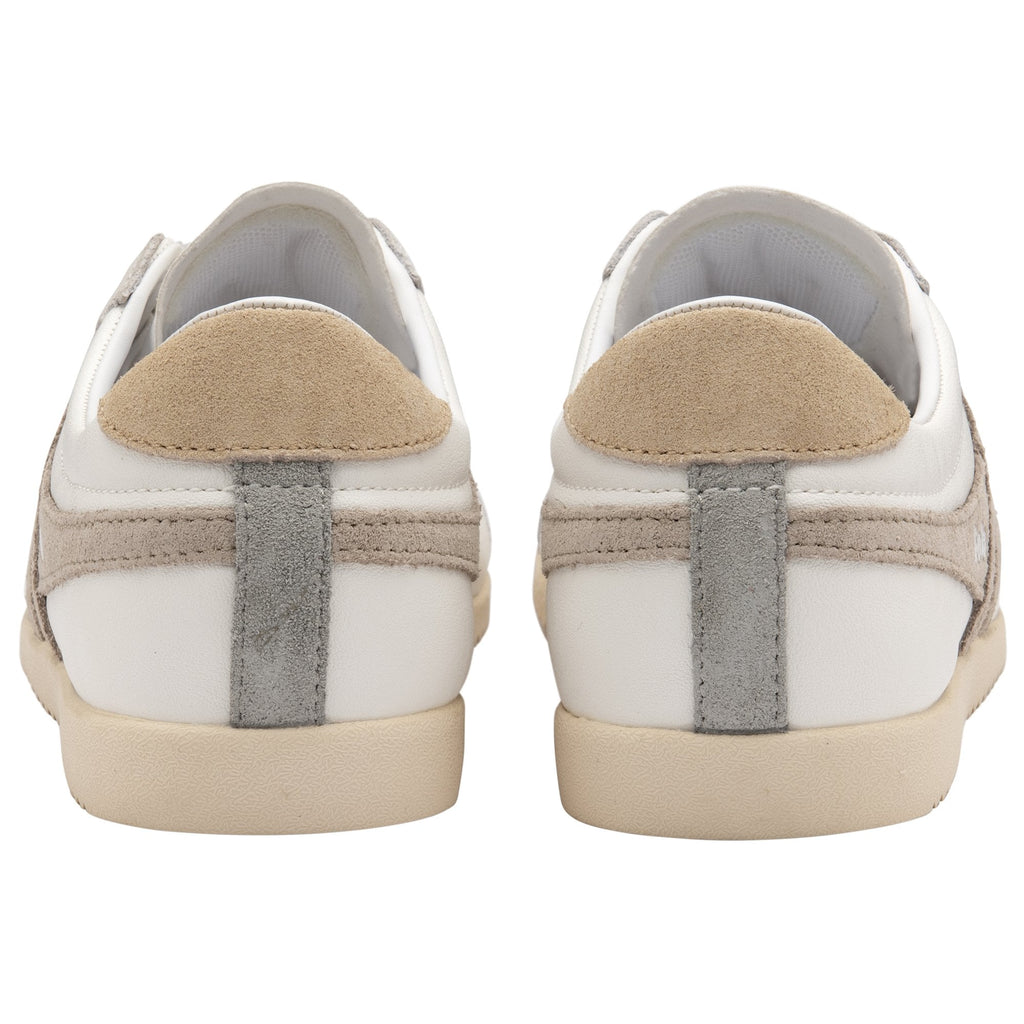 The back of two white Gola Bullet sneakers, showing tan heel accents and stripes.