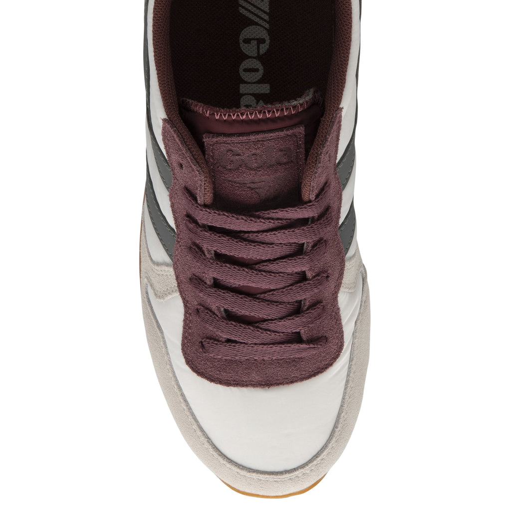 A top view of a Gola white, grey and burgundy trainer.