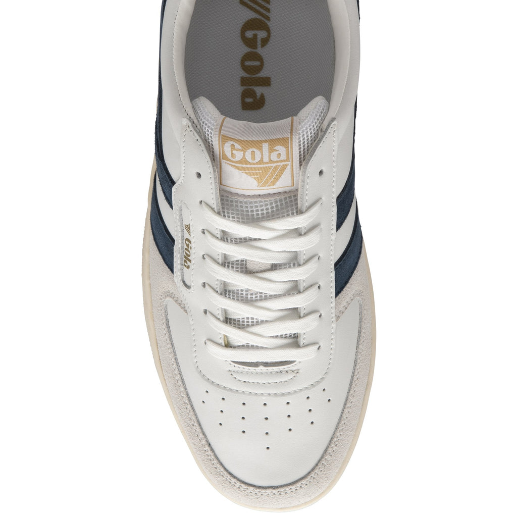 Top-down view of a white Gola sneaker with navy stripes and white laces. 