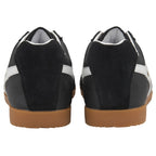 The back view of a pair of black Gola men's sneakers with white stripes and gum soles.