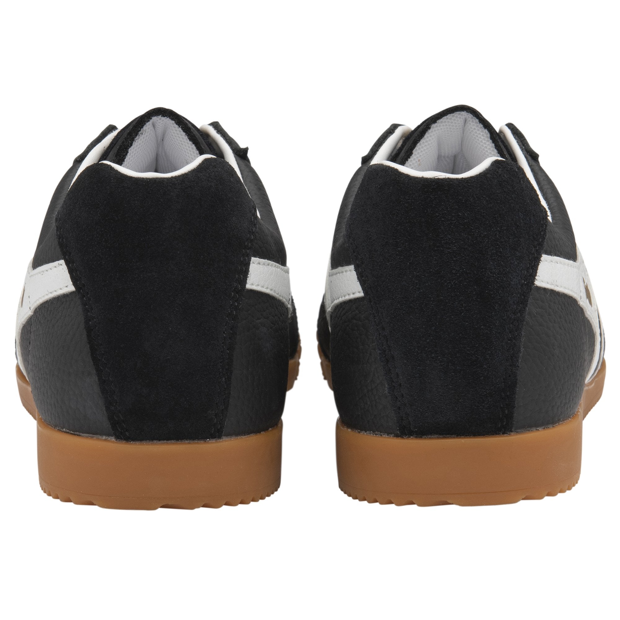 The back view of a pair of black Gola men's sneakers with white stripes and gum soles.