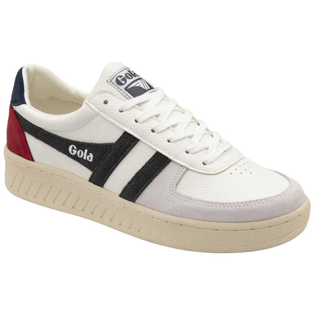 Single white Gola sneaker with black stripes and red and blue details from a slight angle.