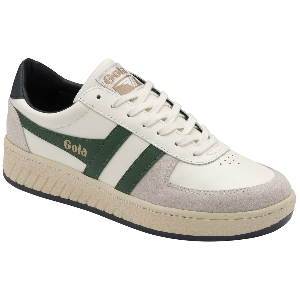 A white and green Gola sneaker with a beige sole, viewed from an angle.