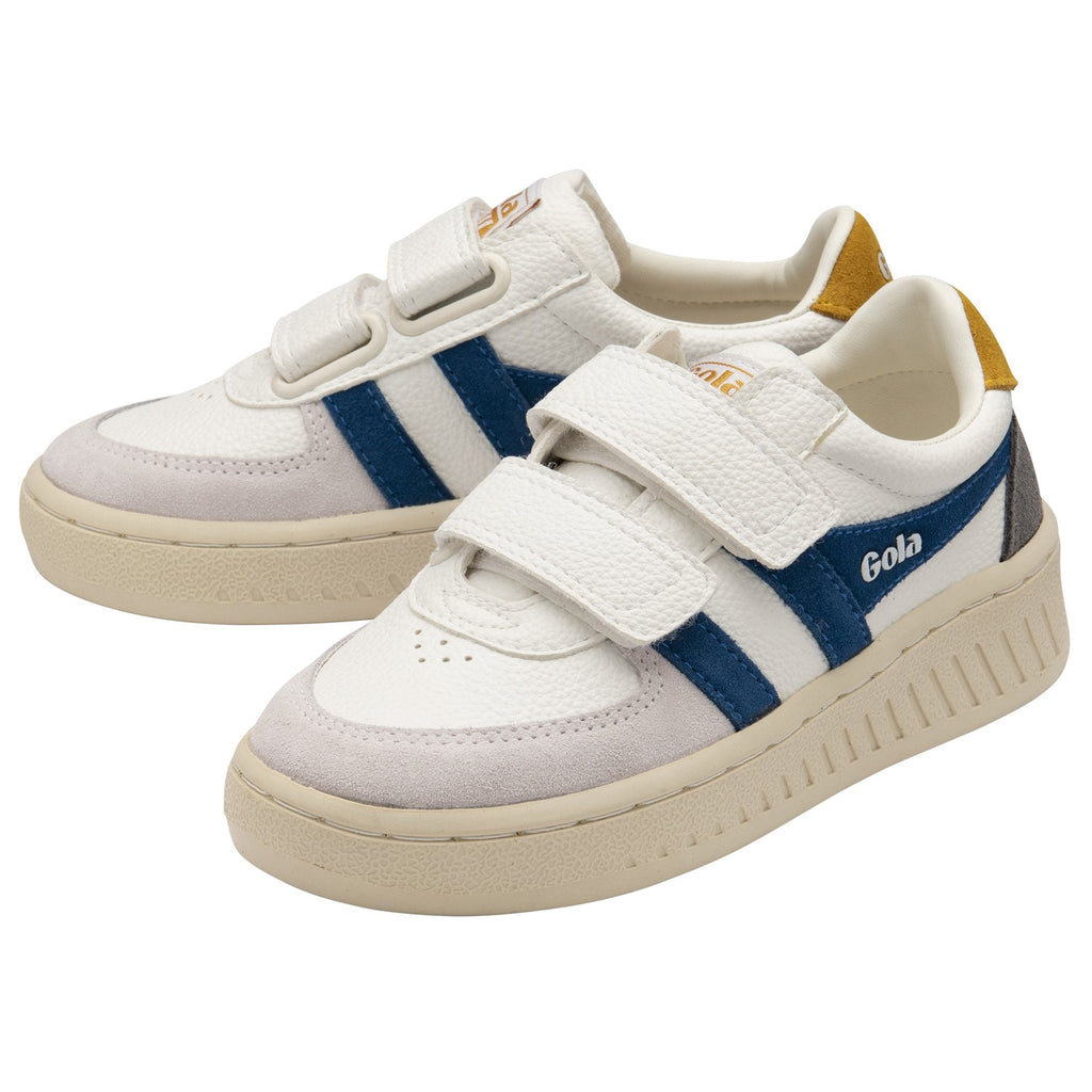 A pair of white Gola sneakers with blue stripes, yellow heel tabs, and white velcro straps.