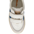 The top-down view of a white Gola sneaker with blue stripes and white velcro straps.