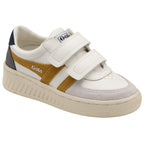 Angled view of a single white Gola sneaker with mustard stripes and velcro closure.