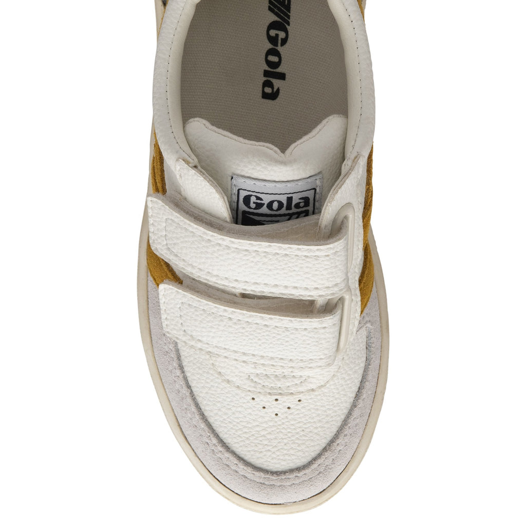 Top-down view of a white Gola sneaker with two velcro straps and mustard stripes.