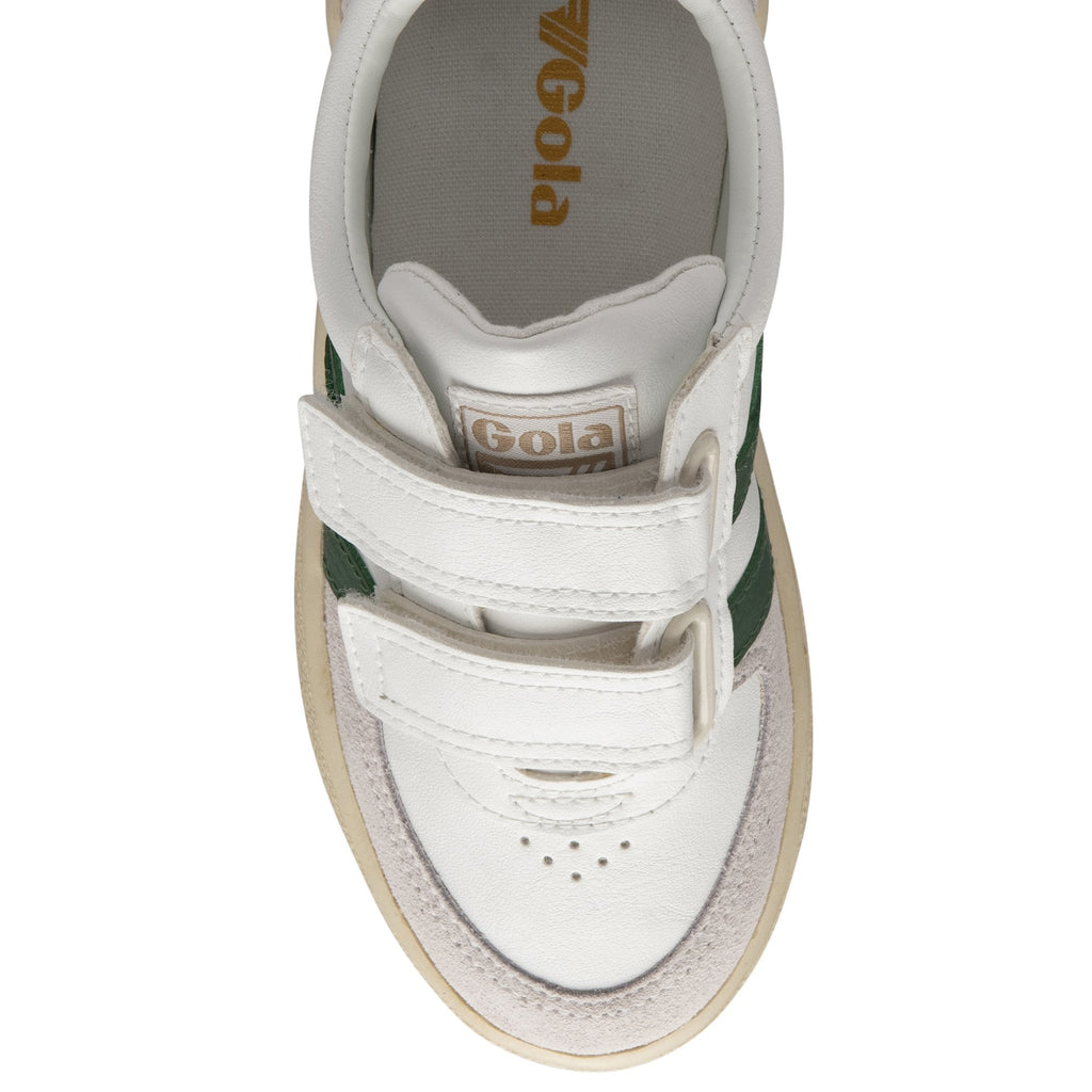 The front top view of a child's white Gola sneaker with green stripes and Velcro straps.