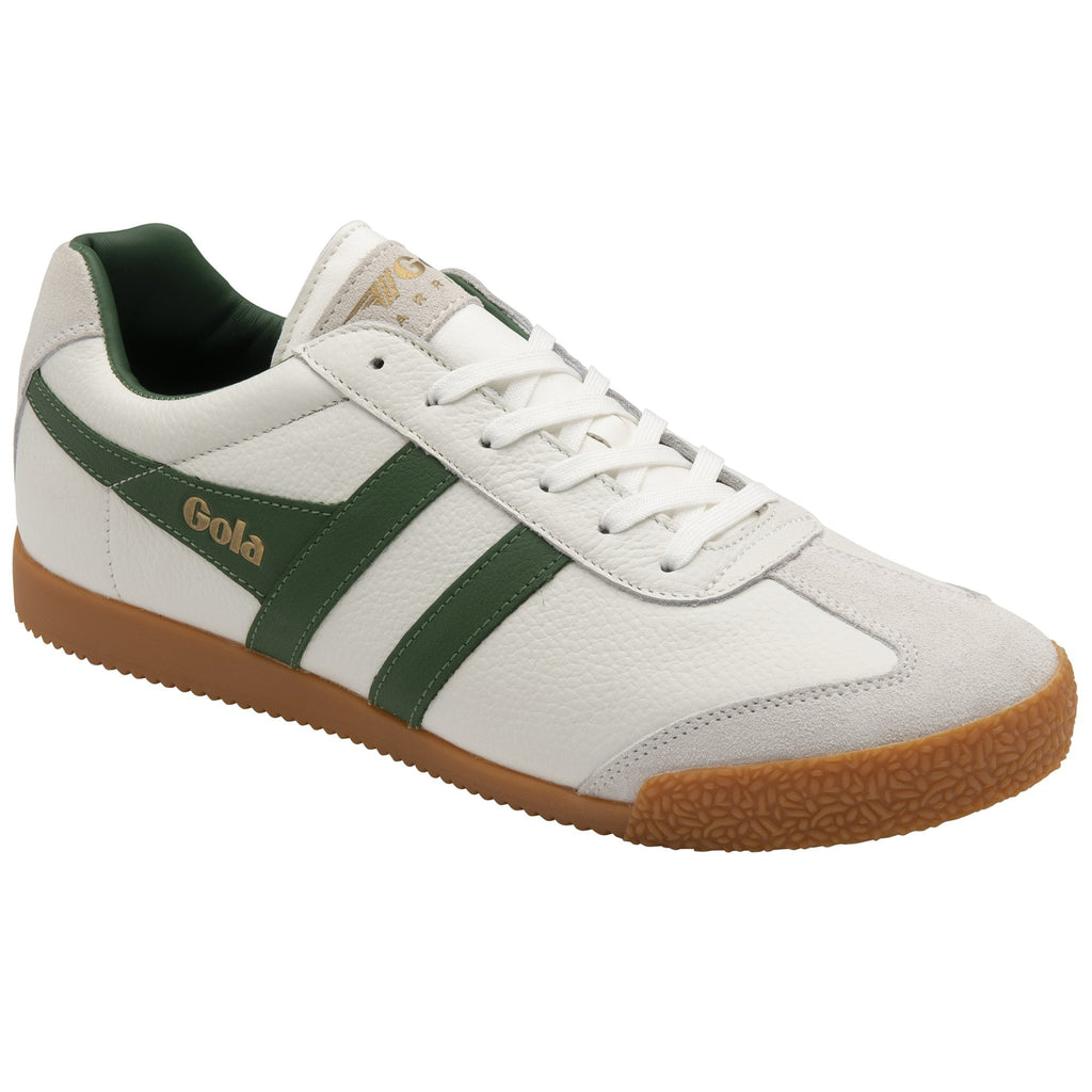 A single white Gola Harrier trainer with green stripes and a gum sole, viewed from an angle.