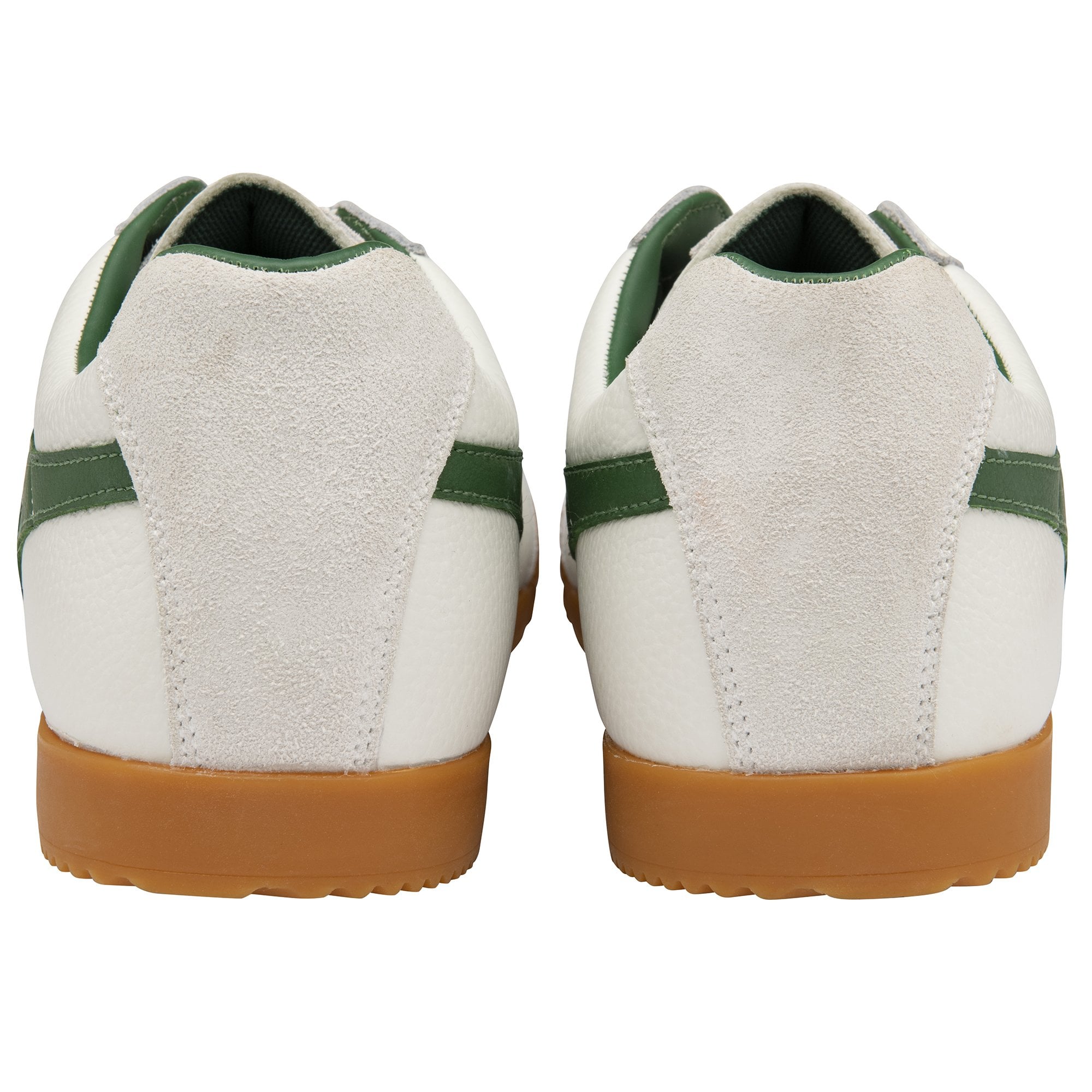 The back view of a pair of white Gola Harrier trainers with green stripes and gum soles.