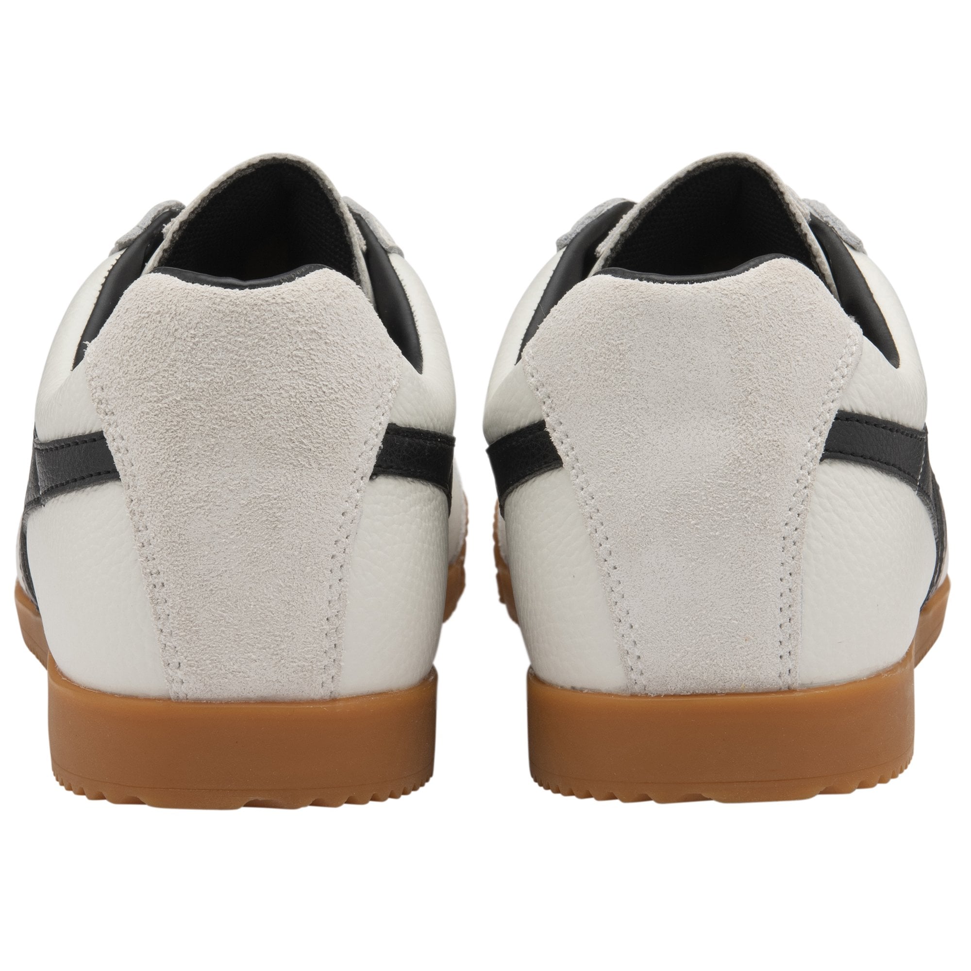 Rear view of two Gola Harrier trainers, white with black accents and gum soles.