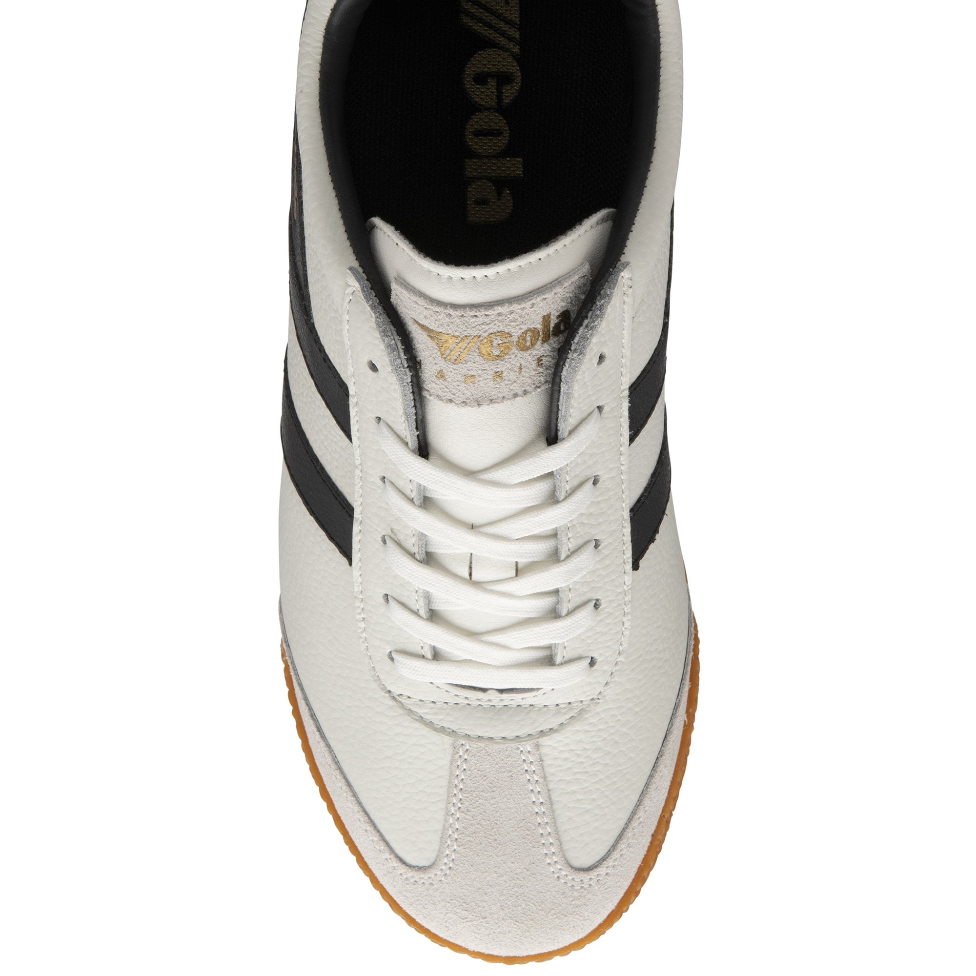 Top-down view of a white Gola Harrier trainer with black stripes and gum sole.