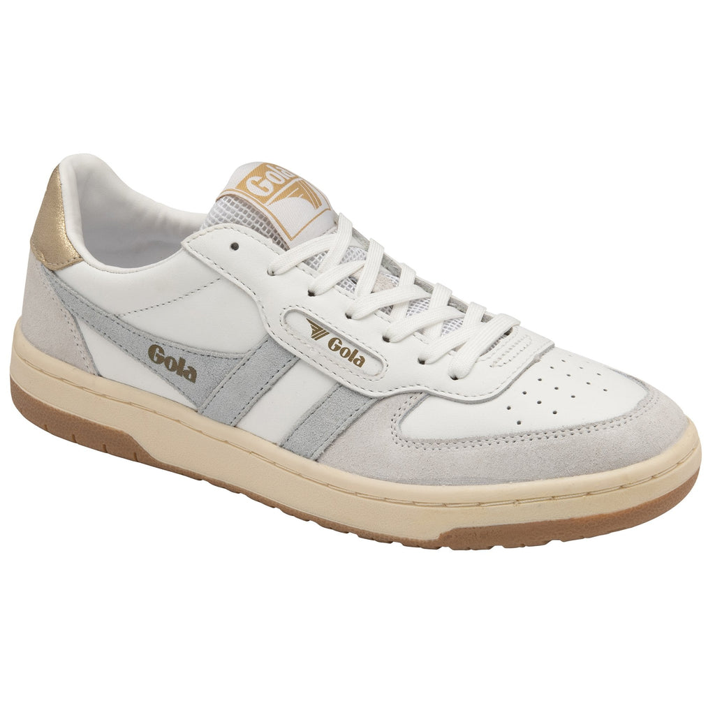Angled view of a white Gola sneaker with silver stripes and a gold heel accent.