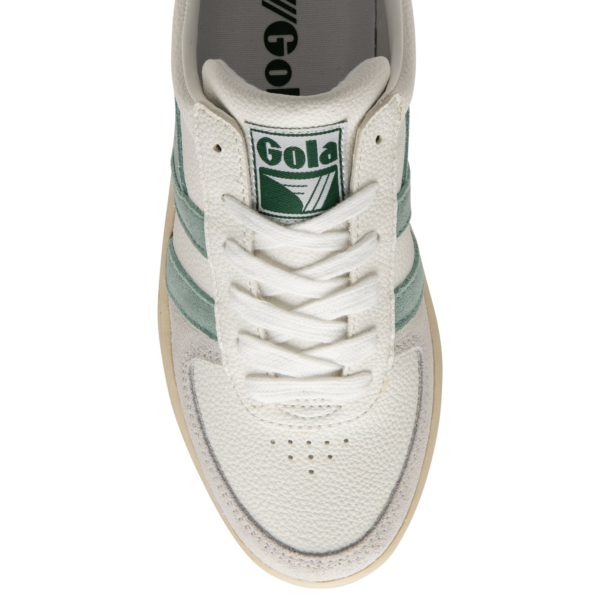 Top-down view of a white Gola sneaker with green stripes and white laces.