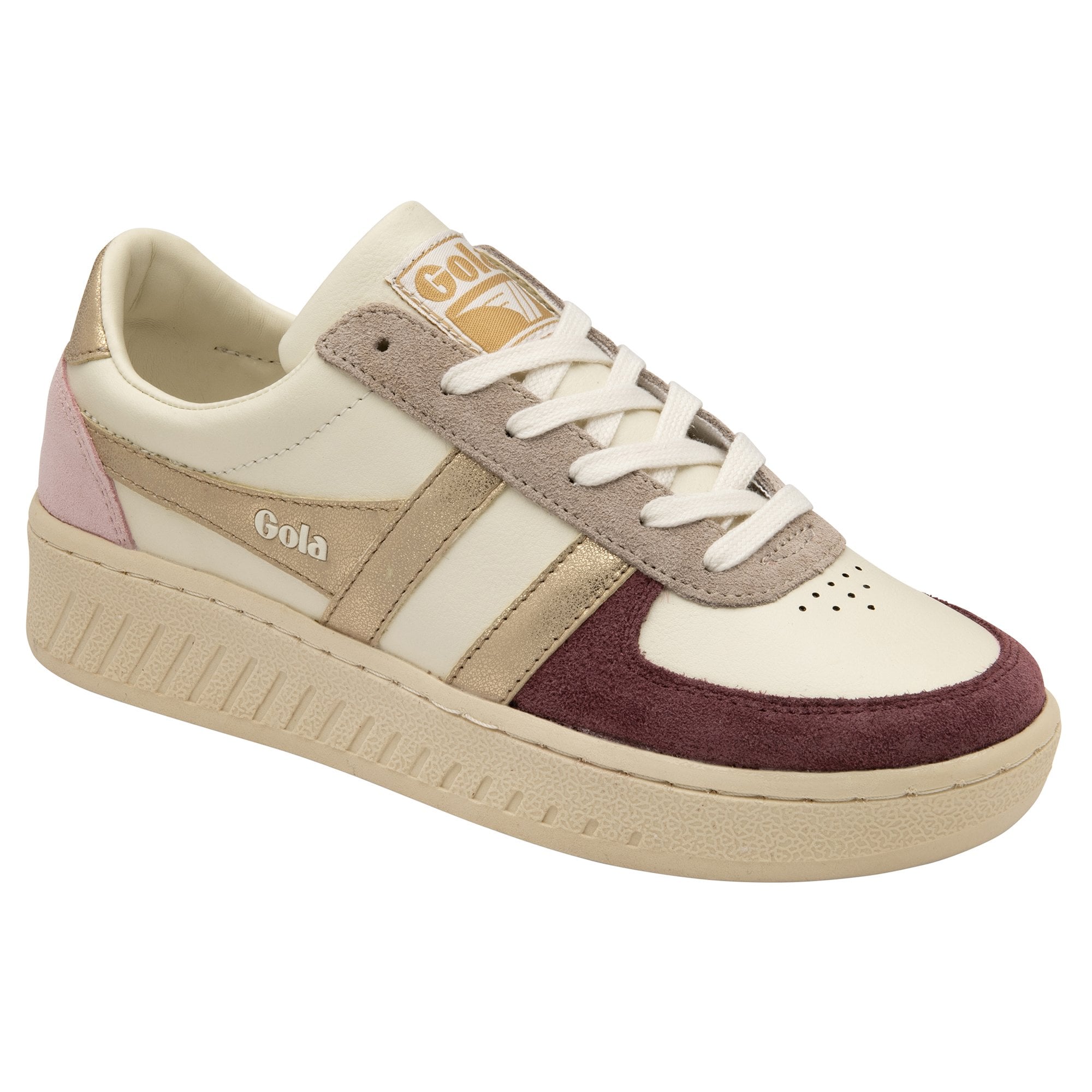 A side view of a women's sneaker with cream, pink, maroon, and gold details on white.