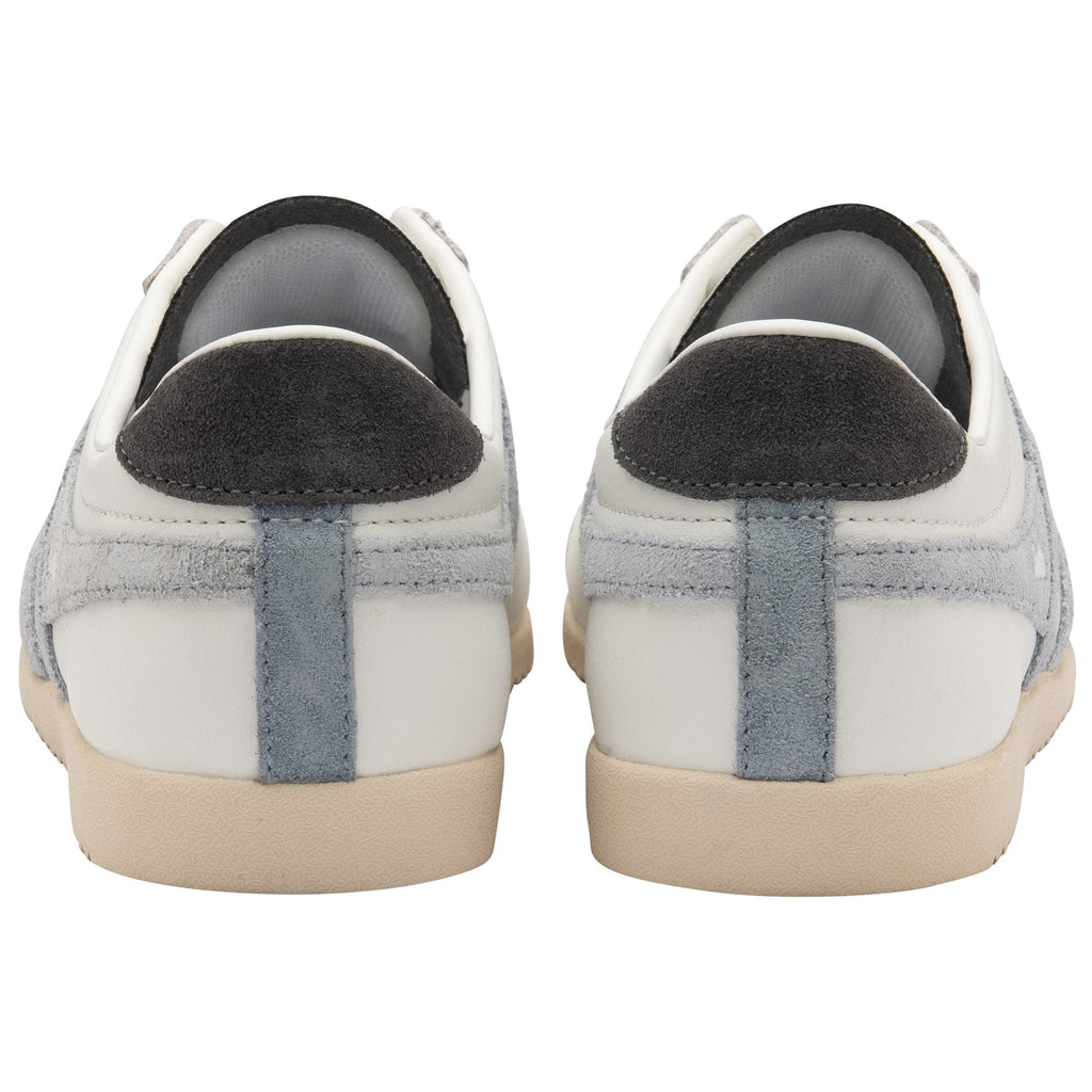 The back view of a pair of white Gola Bullet sneakers with light blue accents.