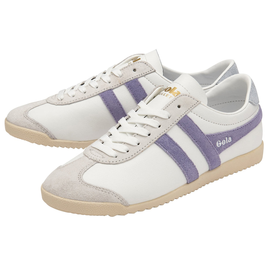 A pair of white Gola Bullet sneakers with purple stripes, angled on a white background.