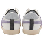 The back view of a pair of white Gola Bullet sneakers with purple stripes on a white background.