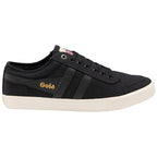 A sleek black canvas sneaker with white soles and gold 'Gola' lettering on the side.