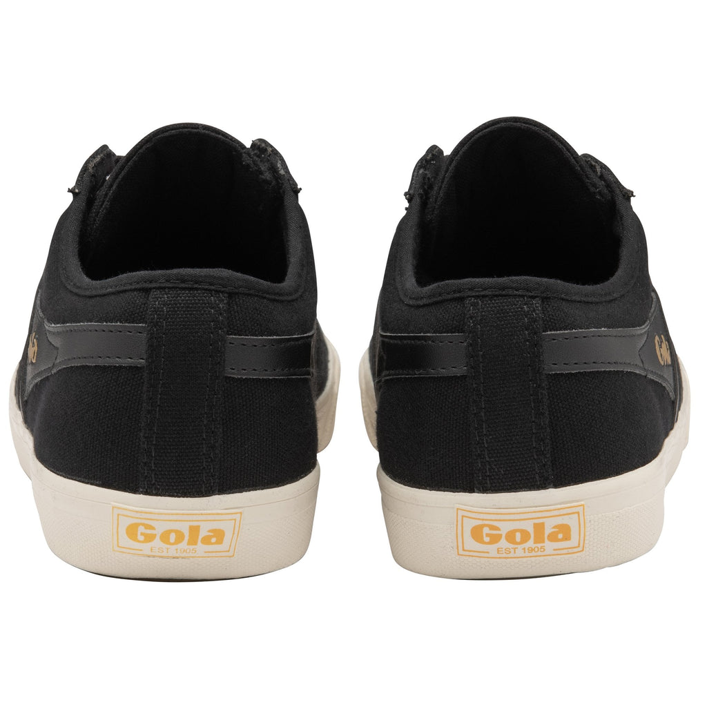 The rear view of two black Gola canvas sneakers with white soles and gold branding.