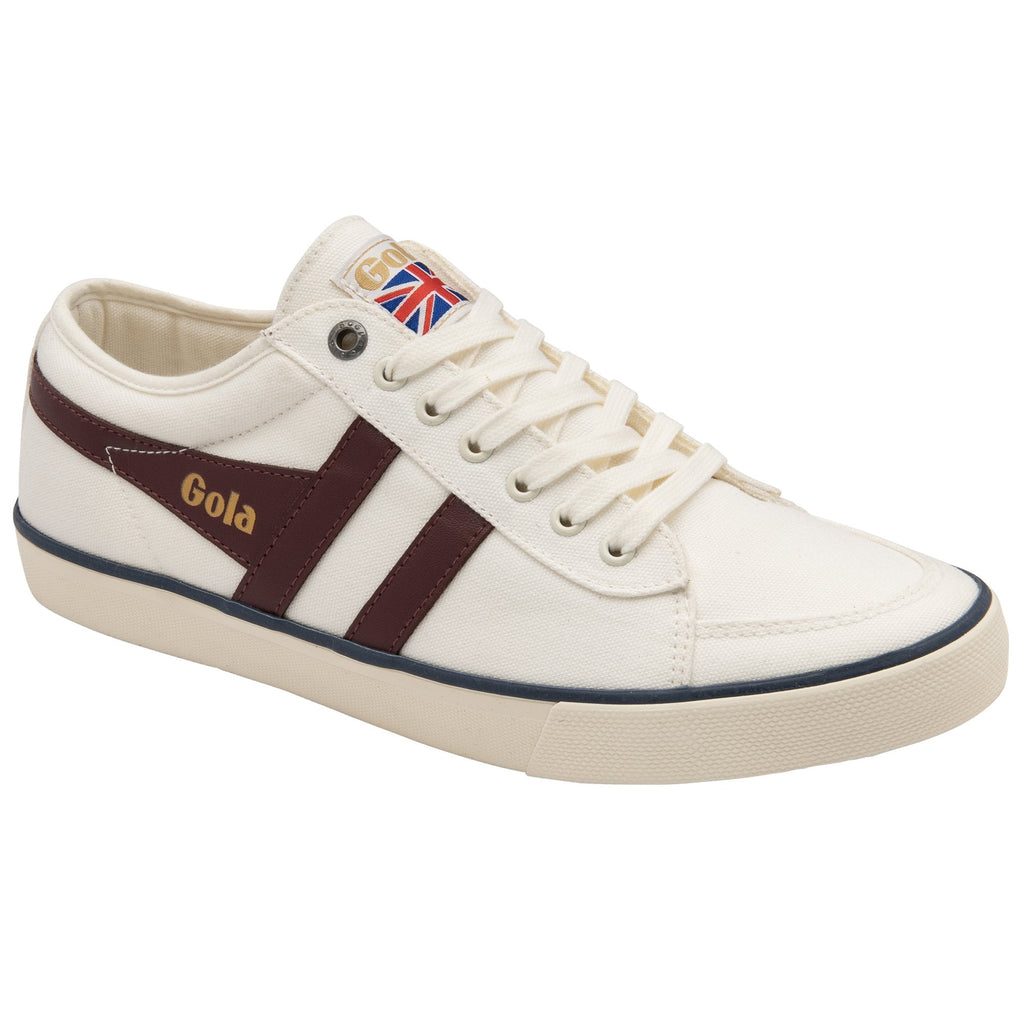 Side profile of a white Gola sneaker with two brown stripes and a British flag logo.