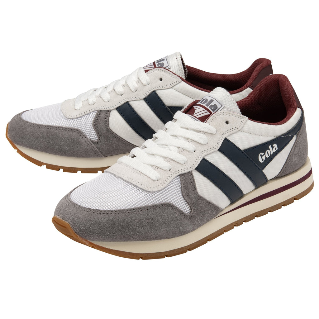 A pair of Gola Hurricane trainers in white with grey suede details and navy blue stripes.