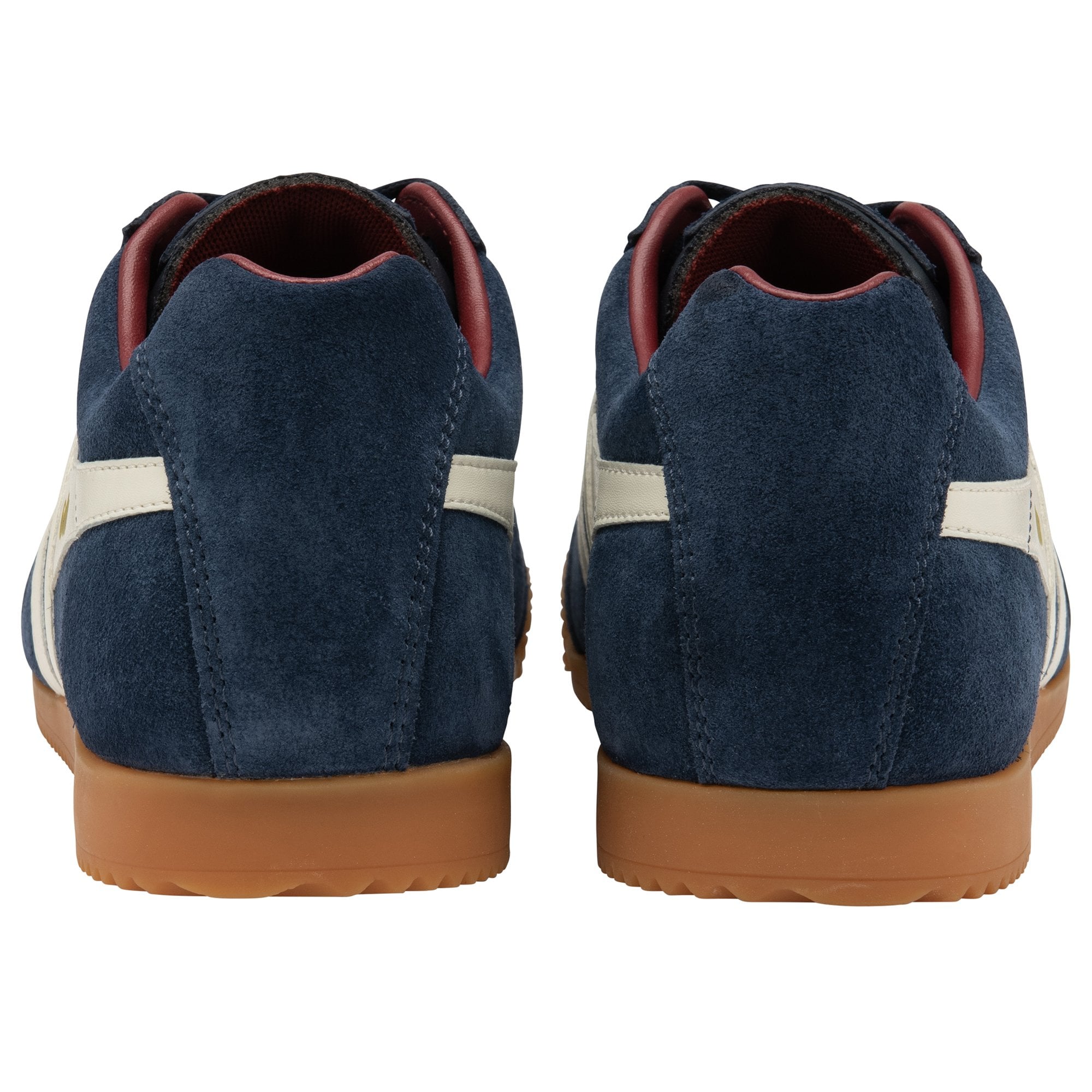 The rear view of a pair of navy blue Gola trainers with white stripes and gum soles.