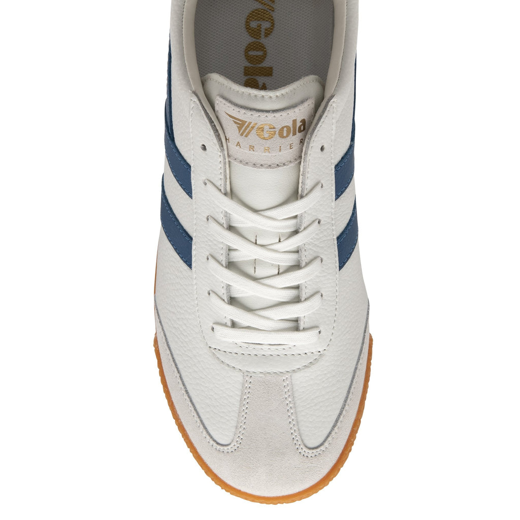 The top-down view of a white Gola Harrier shoe with blue stripes.