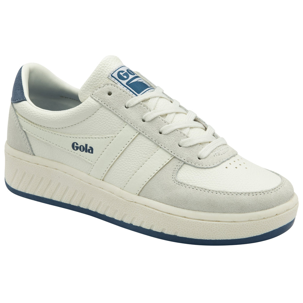 A white trainer with blue trim shown from the side.