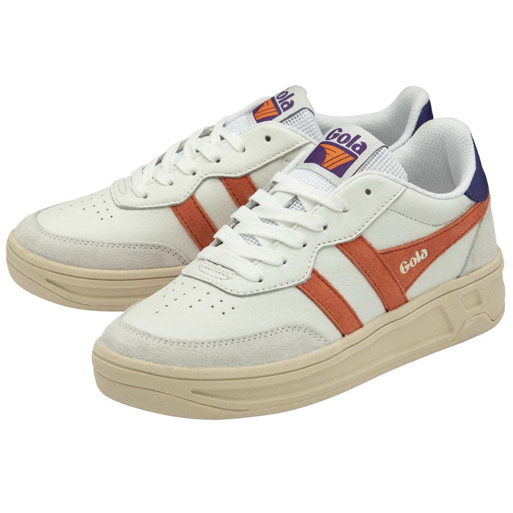 Pair of white Gola sneakers with orange stripes, blue heels, and cream soles.