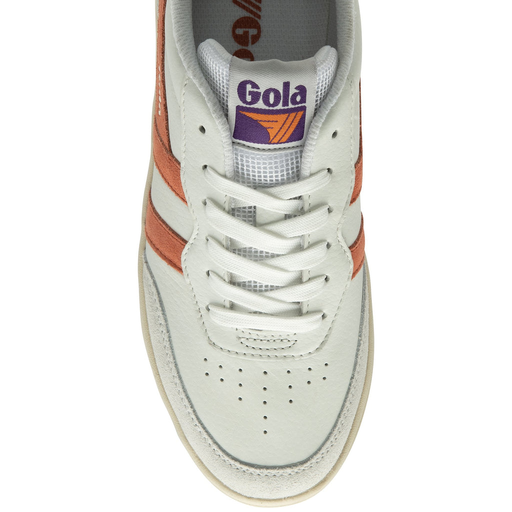 Top-down view of the front of a white Gola sneaker with orange stripes and white laces.
