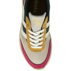 A top-down view of a women's trainer, made with green, red, beige and yellow fabrics.