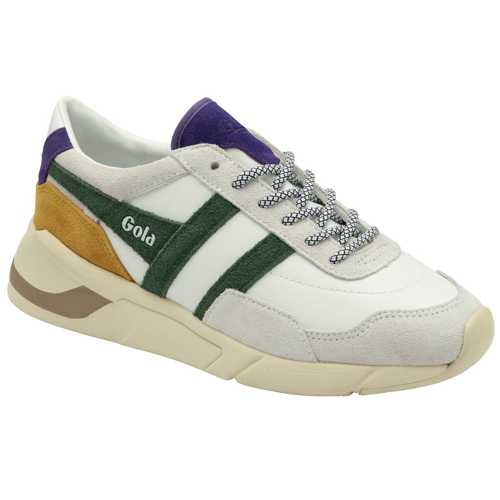 A white Gola sneaker with green stripes, yellow and purple accents, shown from the side.