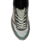 Top profile of a man's Gola shoe, light gray, dark gray, peach, and seafoam green.