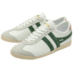 A pair of white Gola Bullet trainers with green stripes and pink heel tabs, angled together.