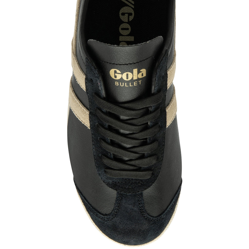 An overhead view of a black Gola Bullet sneaker with tan stripes and black laces.