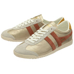 Pair of gold and red Gola sneakers with white laces, side by side.