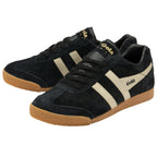 Two black suede sneakers with beige Gola logos and stripes, viewed from an angle.