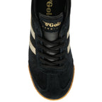 The top-down view of a black suede sneaker with a gold Gola logo and beige stripes.