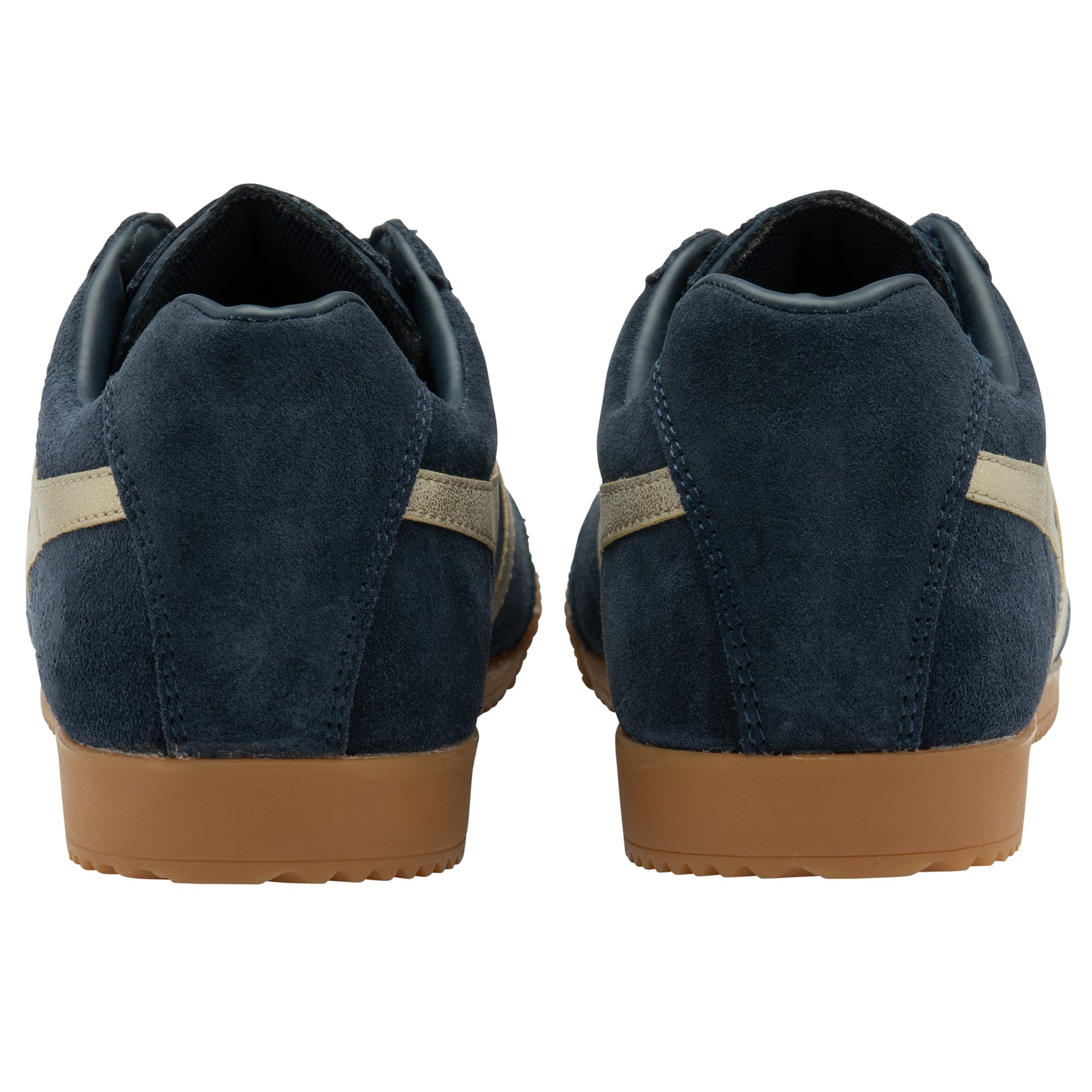 The back view of a pair of Gola Harrier trainers in navy and beige.