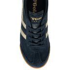 A top-down view of a single Gola Harrier trainer in navy and beige.