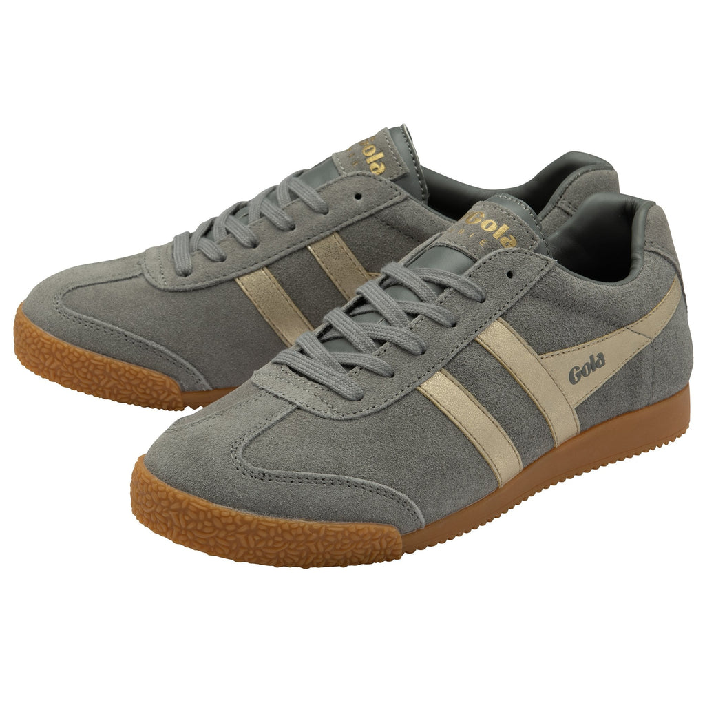 A pair of grey Gola trainers with beige stripes and gum soles.
