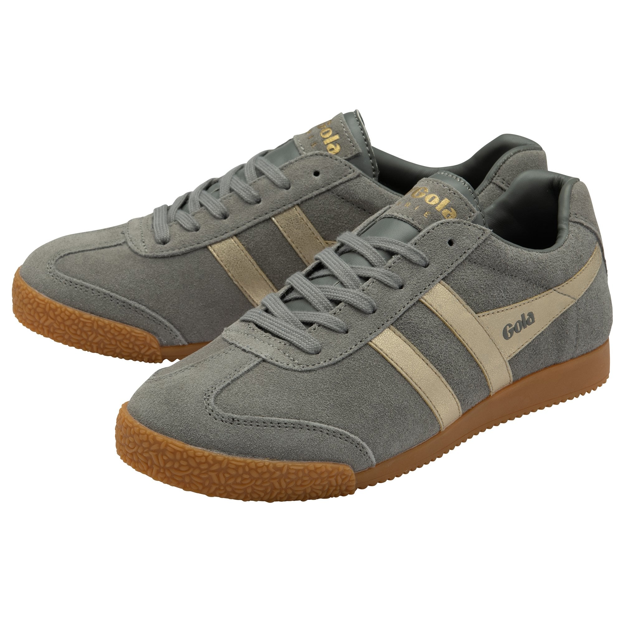 A pair of grey Gola trainers with beige stripes and gum soles.