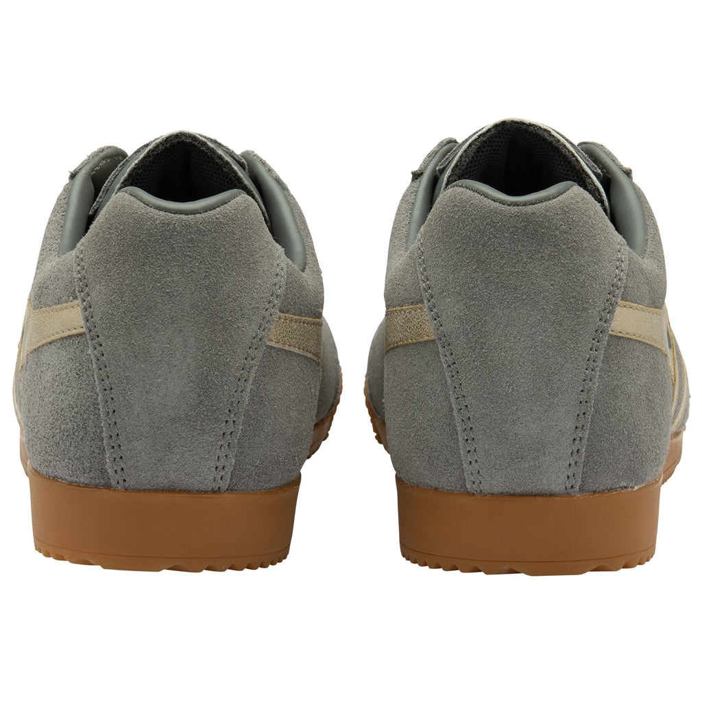 Back view of a pair of grey Gola trainers with beige stripes and gum soles.