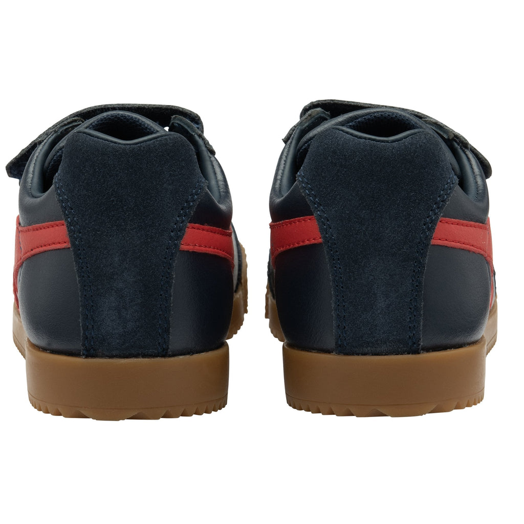 A back view of two navy blue Gola trainers with red stripes and a gum sole.