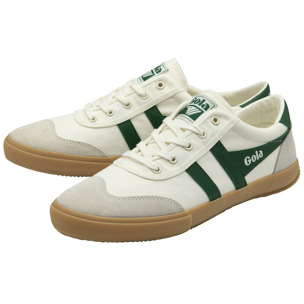 A pair of white Gola sneakers with green stripes and laces, viewed from the side.